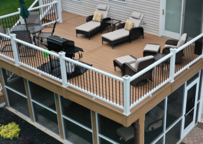 Deck and screen room in Twp of Washington using composite decking and railings