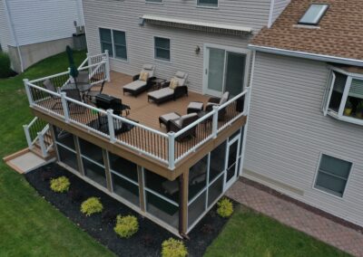 Deck and screen room in Twp of Washington using composite decking and railings