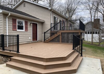 Custom Deck in Ringwood with composite decking and aluminum railings and lattice skirting