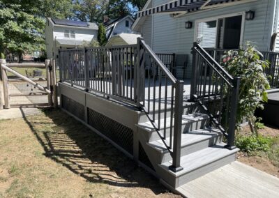 Deck in Allendale with composite decking and aluminum railings and lattice skirting
